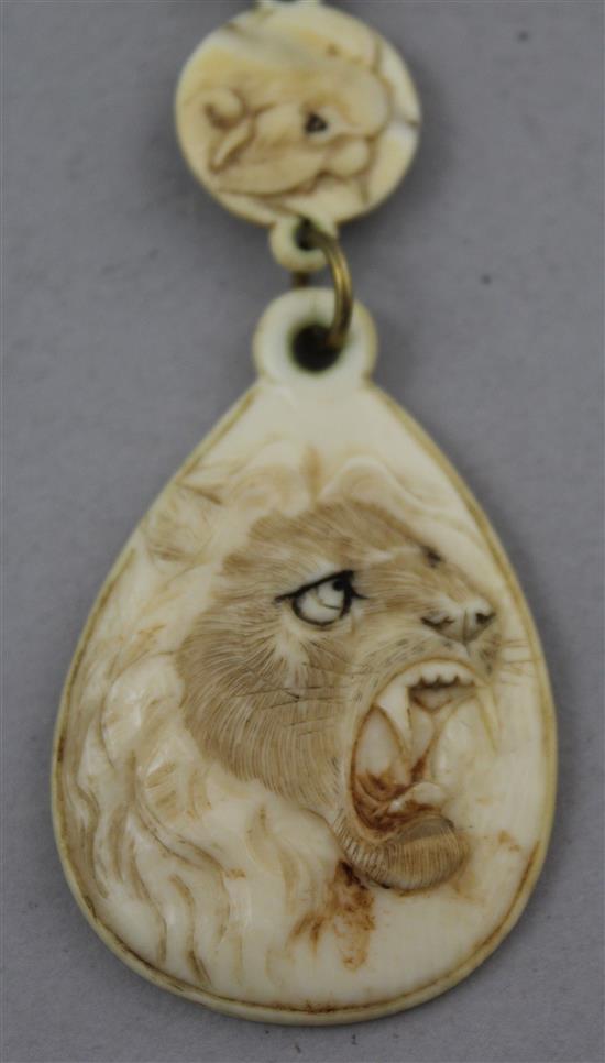 Two Japanese carved ivory necklaces, early 20th century,